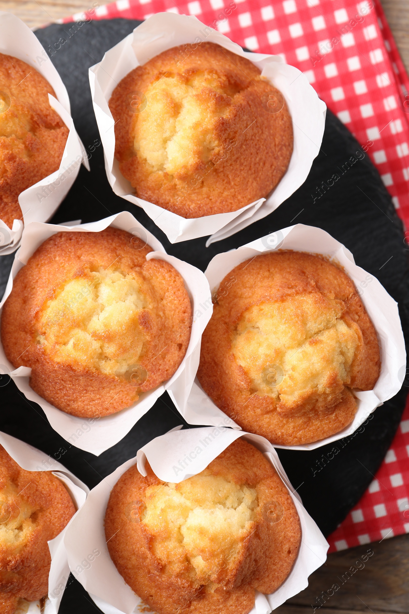 Photo of Delicious sweet muffins on table, top view