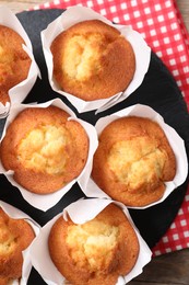 Photo of Delicious sweet muffins on table, top view