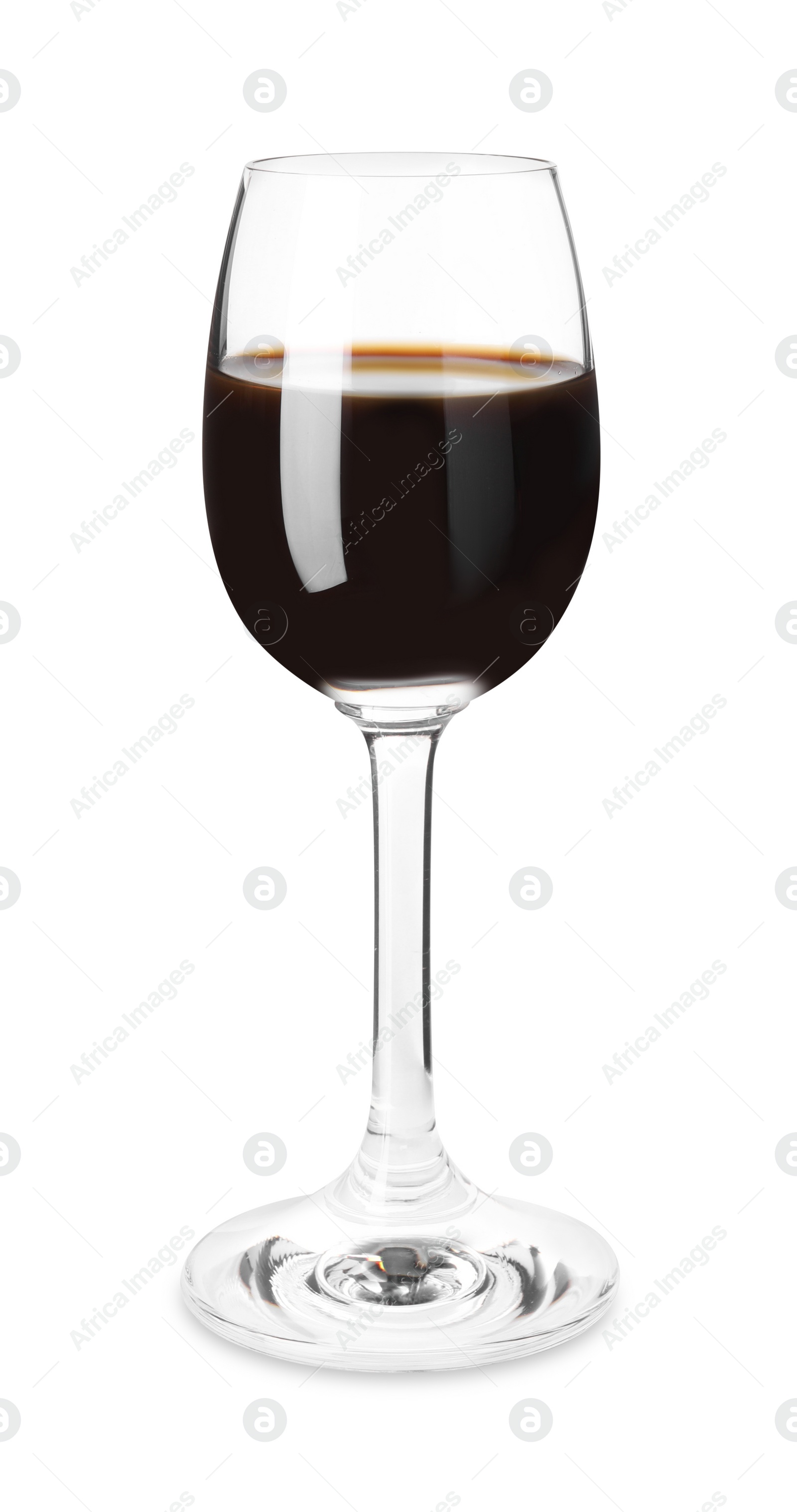 Photo of Shot glass with coffee liqueur isolated on white