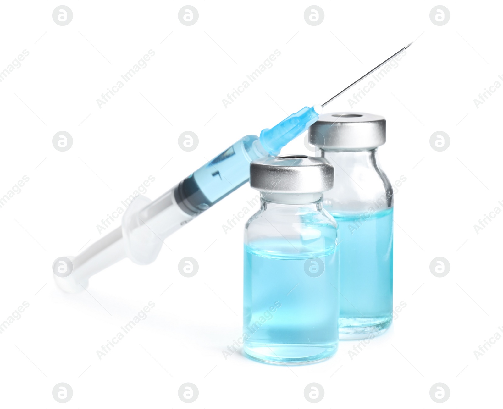 Photo of Vials and syringe on white background. Vaccination and immunization