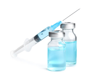 Vials and syringe on white background. Vaccination and immunization