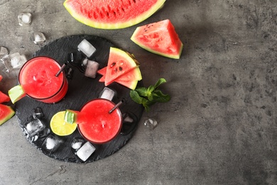 Tasty summer watermelon drink in glasses and space for text on table, top view