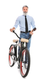 Portrait of handsome mature man with bicycle on white background