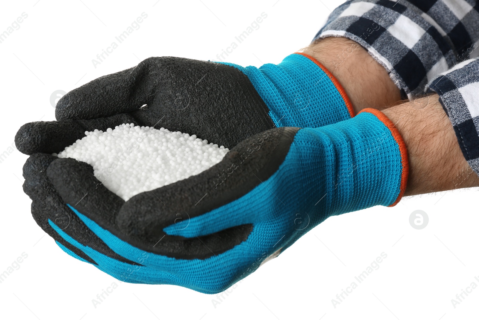 Photo of Man holding ammonium nitrate pellets on white background, closeup. Mineral fertilizer
