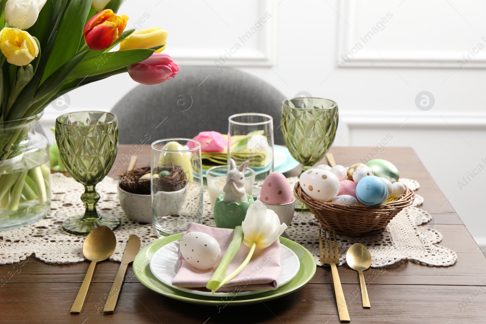 Photo of Festive table setting with beautiful flowers. Easter celebration