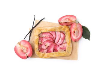 Photo of Delicious galette with apples and vanilla sticks isolated on white, top view