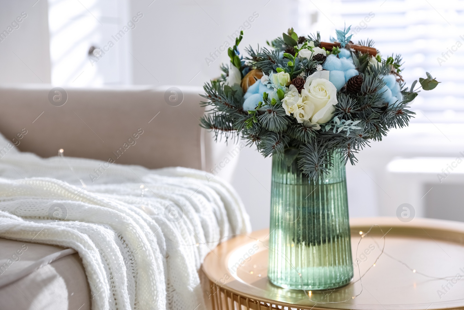 Photo of Beautiful wedding winter bouquet on table indoors. Space for text