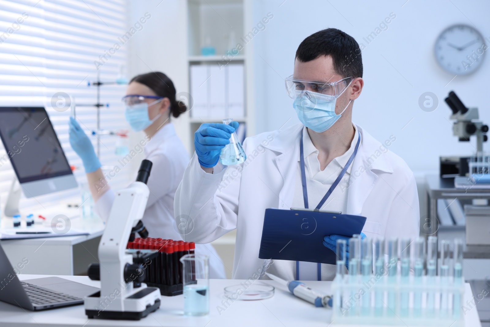 Photo of Scientists working with samples in laboratory. Medical research