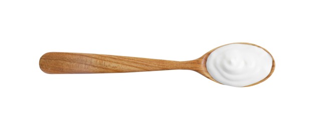 Photo of One wooden spoon with sour cream isolated on white, top view