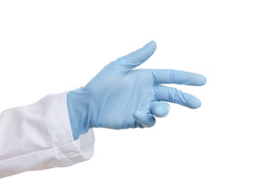 Doctor wearing light blue medical glove on white background, closeup