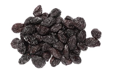 Heap of sweet dried prunes on white background, top view
