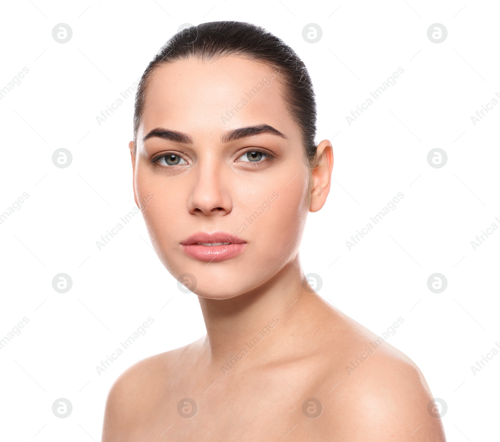 Photo of Portrait of young woman with beautiful face and natural makeup on white background