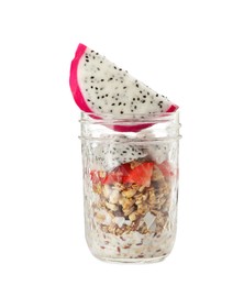 Photo of Granola with strawberries and pitahaya in glass jar on white background