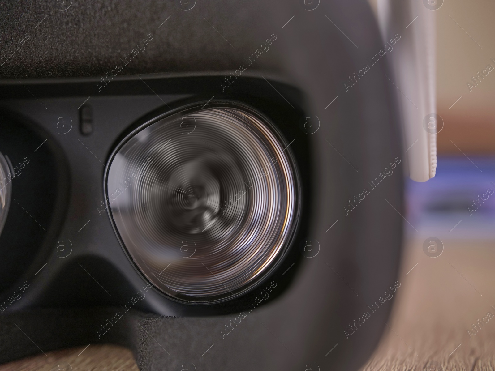 Photo of Modern virtual reality headset on table, closeup