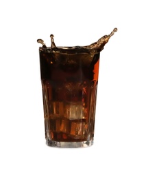 Cola splashing out of glass on light background