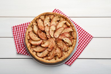 Photo of Delicious apple pie on white wooden table, top view