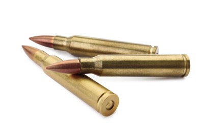 Photo of Three bullets on white background. Military ammunition