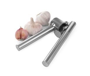 Photo of One metal press and garlic bulbs isolated on white