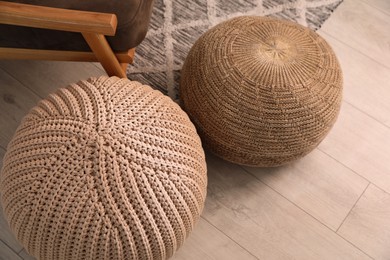 Stylish comfortable poufs on floor, above view. Home design