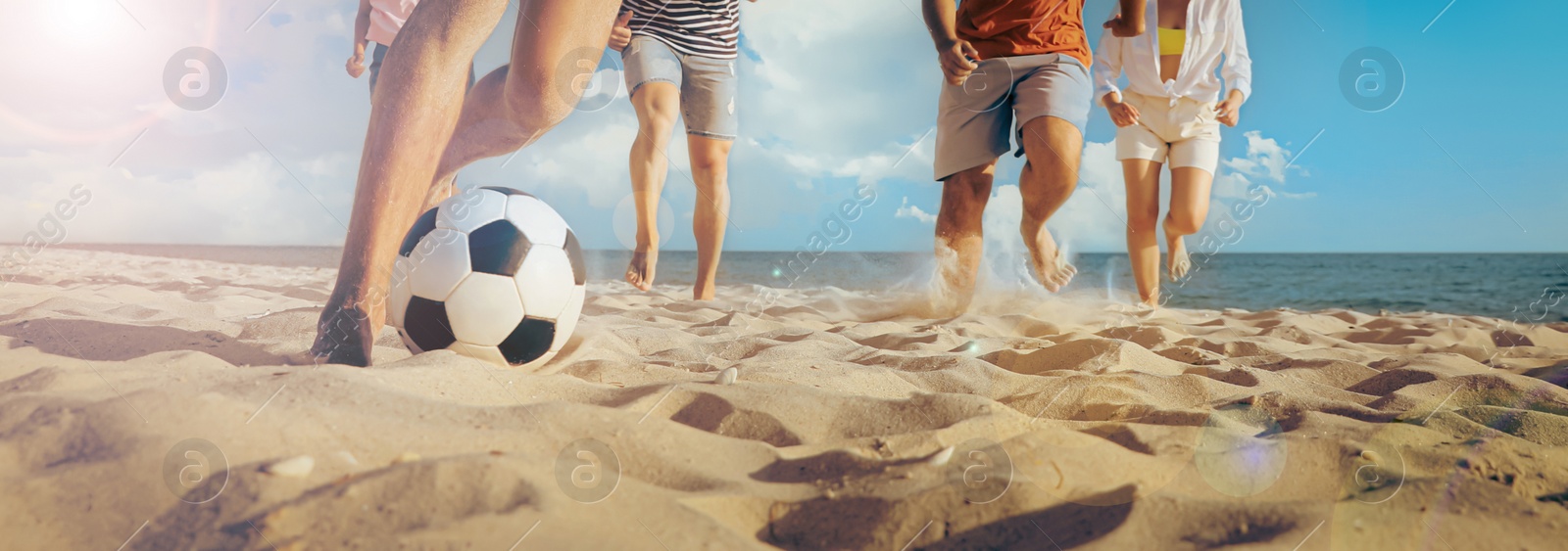 Image of Friends playing football on beach during sunny day, closeup. Banner design