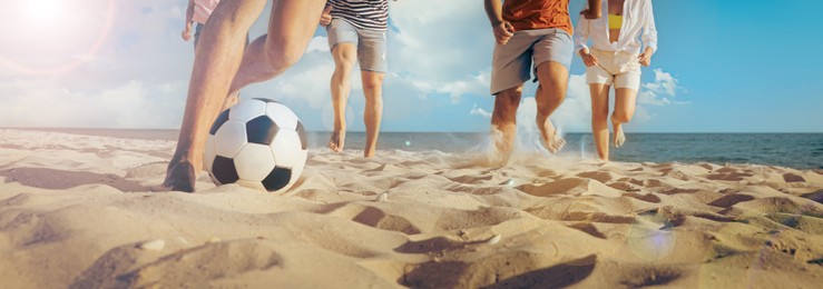 Friends playing football on beach during sunny day, closeup. Banner design