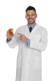 Professional pharmacist with pills on white background