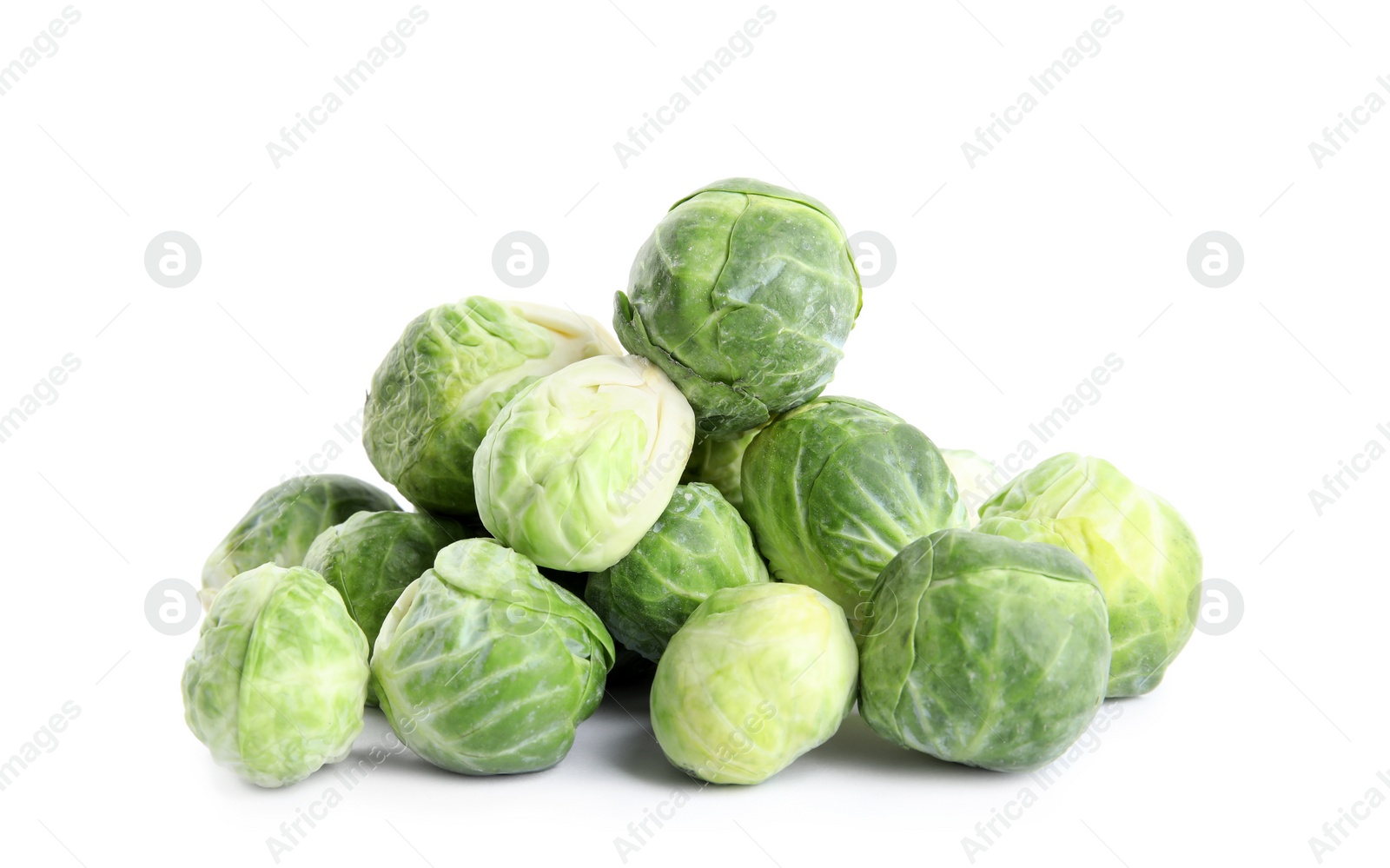 Photo of Pile of fresh Brussels sprouts isolated on white