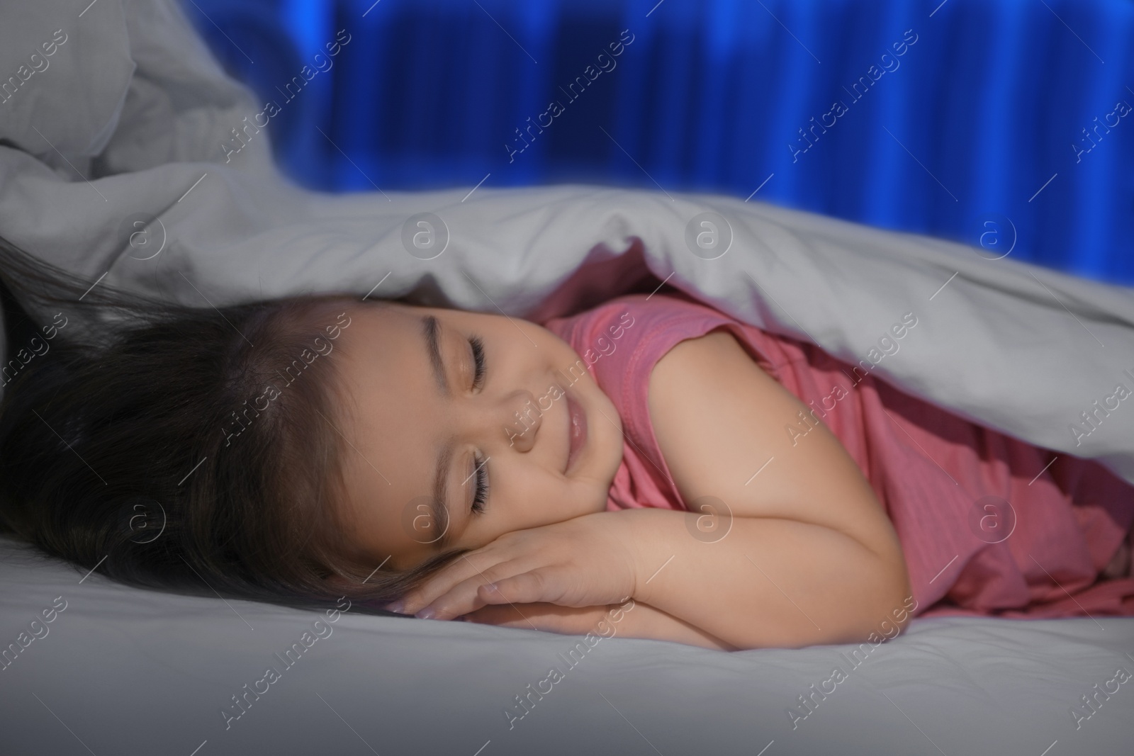 Photo of Cute little girl sleeping at home. Bedtime schedule