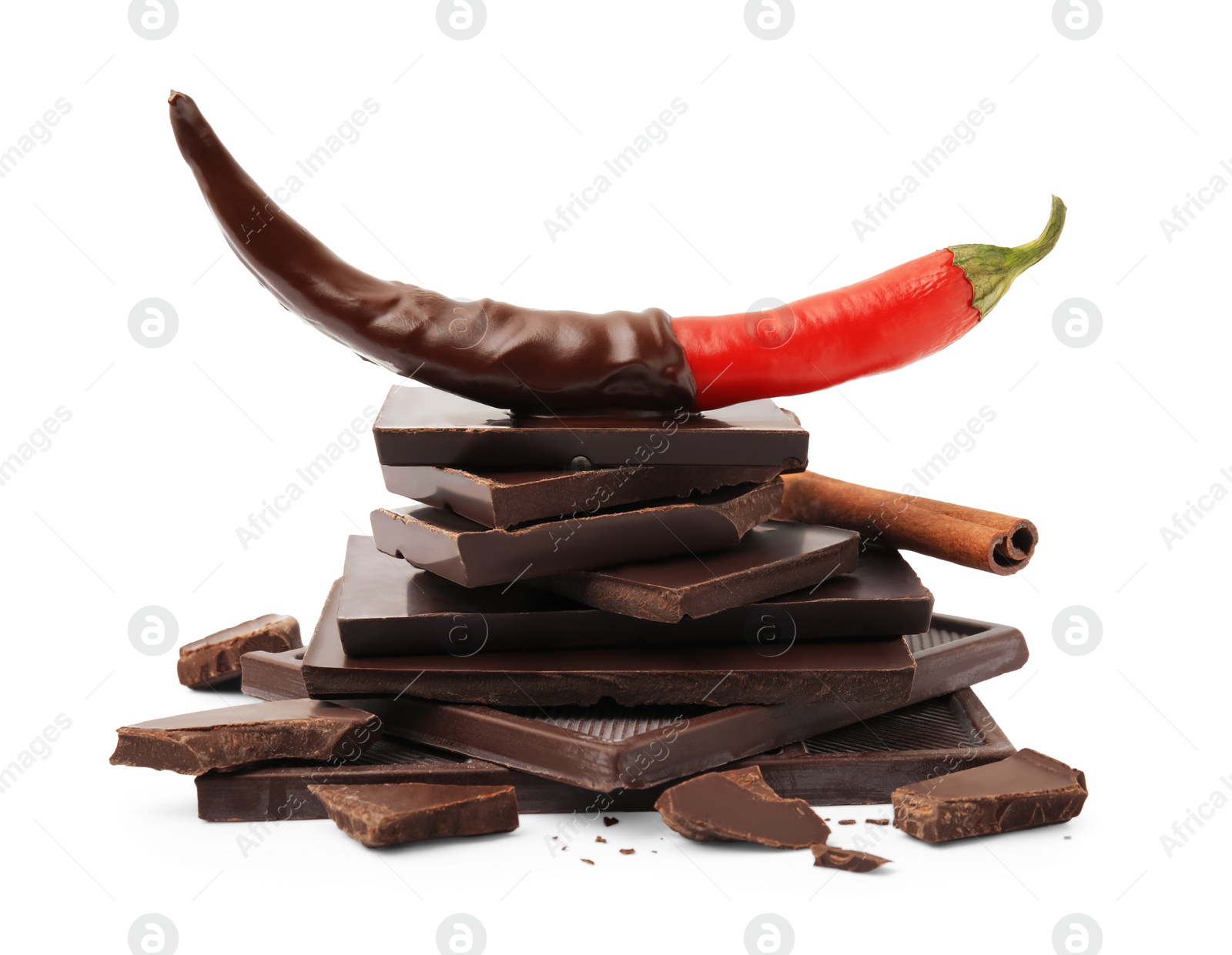 Photo of Red hot chili pepper and dark chocolate with cinnamon isolated on white