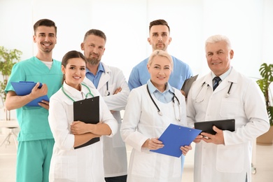 Photo of Group of doctors in uniform at clinic. Cardiology conference