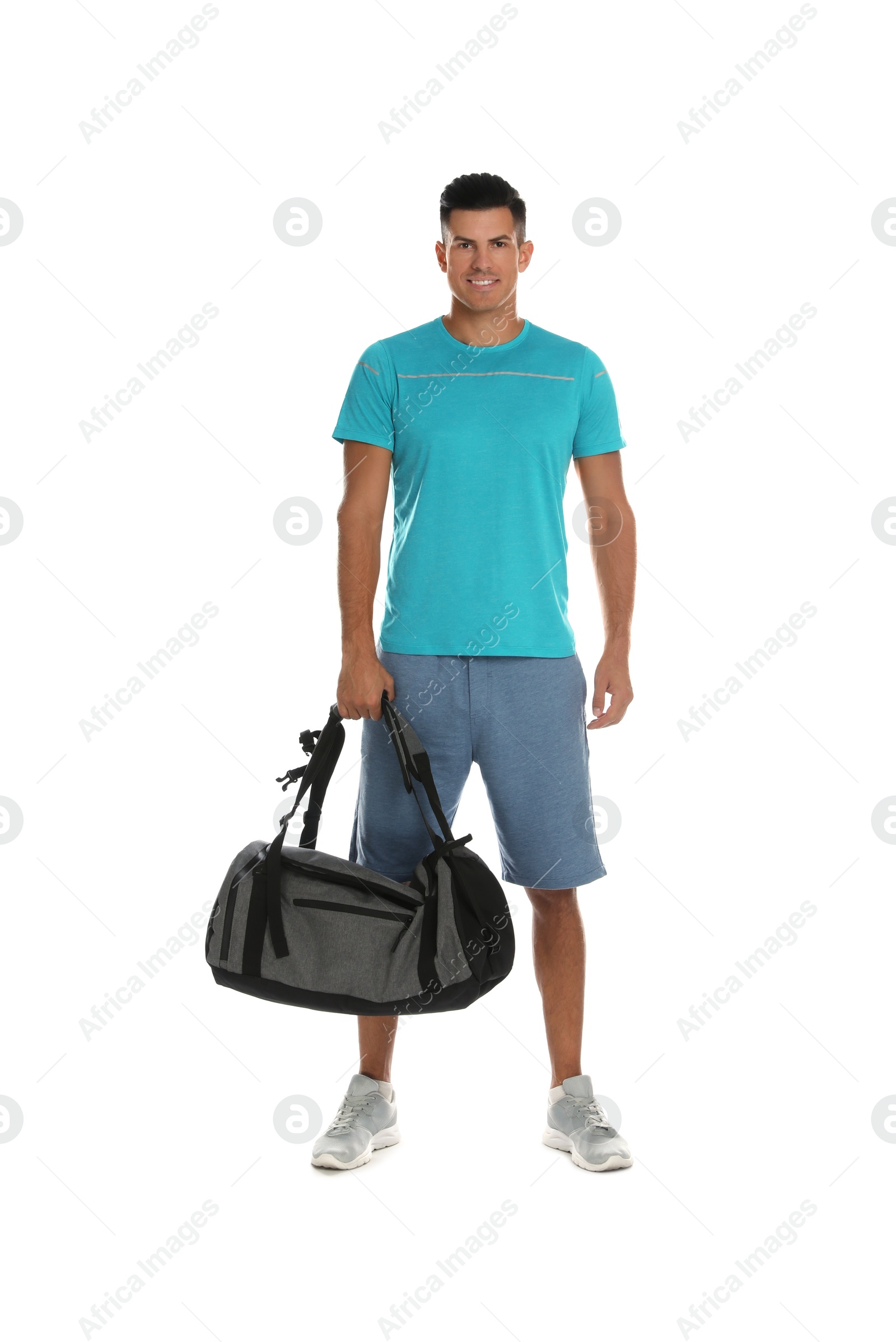 Photo of Handsome man with sports bag on white background