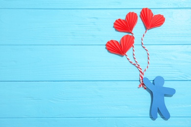 Photo of Composition with small paper hearts on wooden background, top view