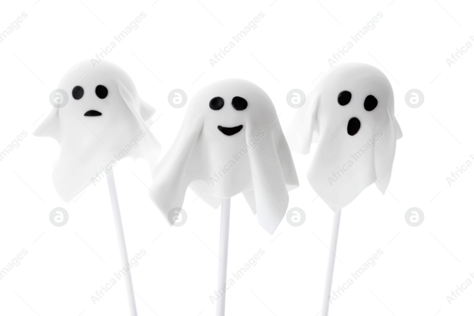 Photo of Delicious ghost cake pops on white background. Halloween holiday