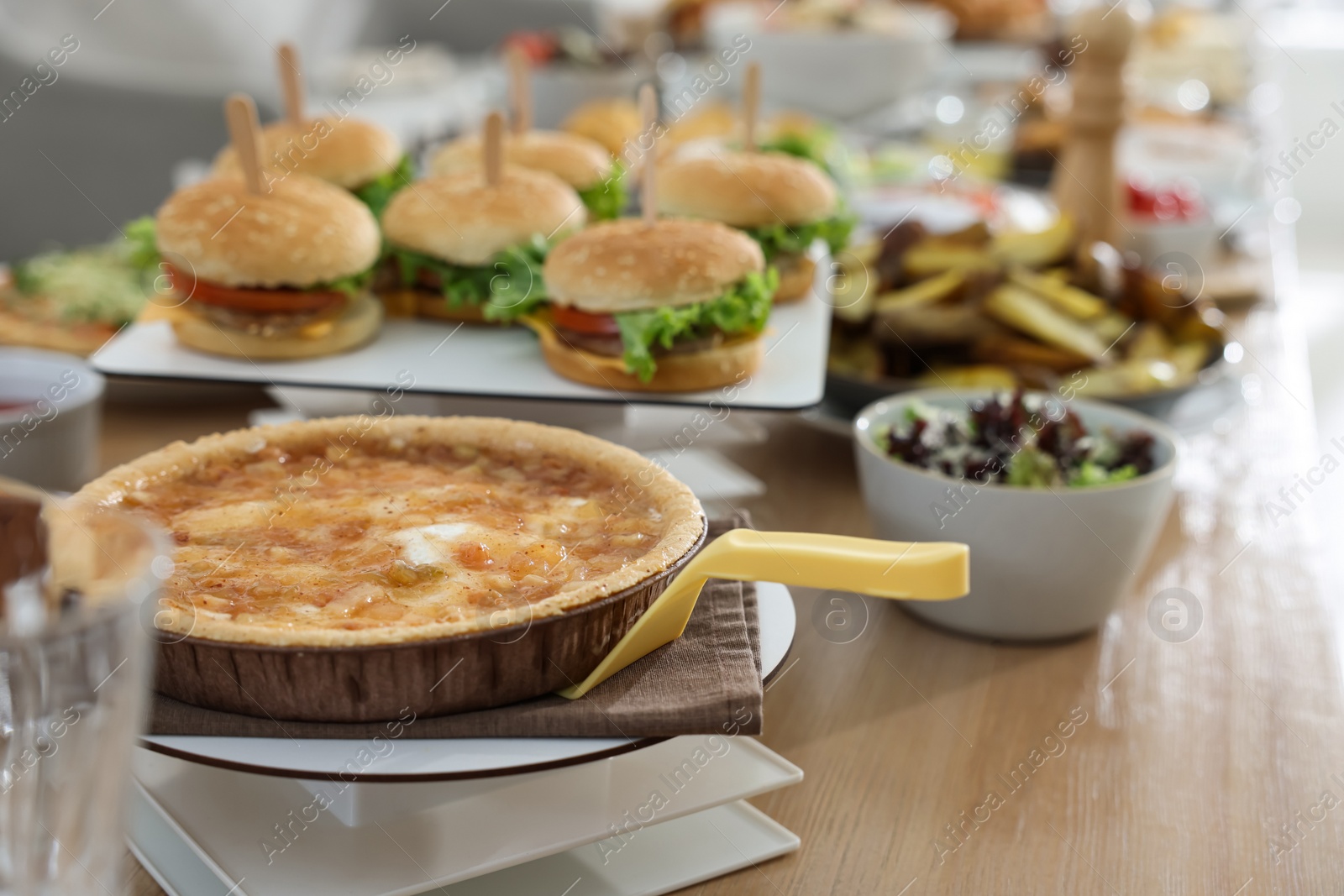 Photo of Brunch table setting with different delicious food indoors