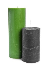 Photo of Two decorative wax candles on white background