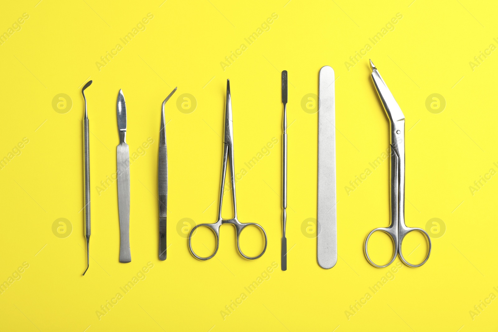 Photo of Set of medical instruments on color background, flat lay