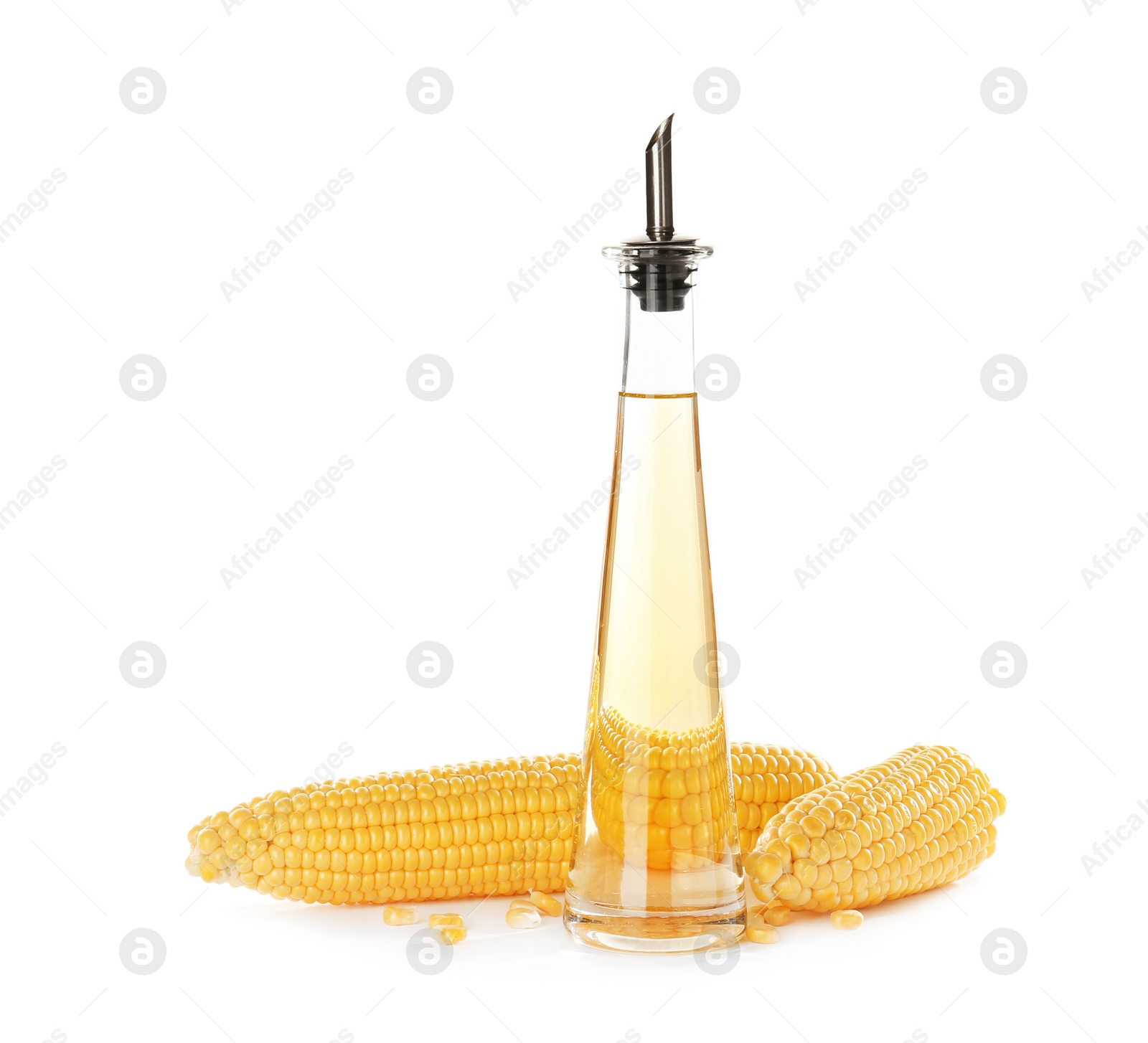 Photo of Bottle of corn oil and fresh cobs on white background