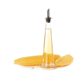 Bottle of corn oil and fresh cobs on white background