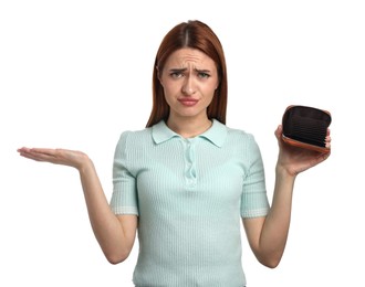 Upset woman with empty wallet on white background