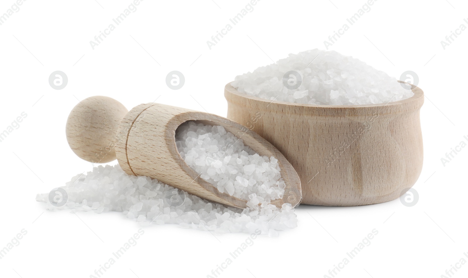 Photo of Natural salt in wooden bowl and scoop isolated on white