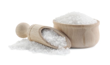 Photo of Natural salt in wooden bowl and scoop isolated on white