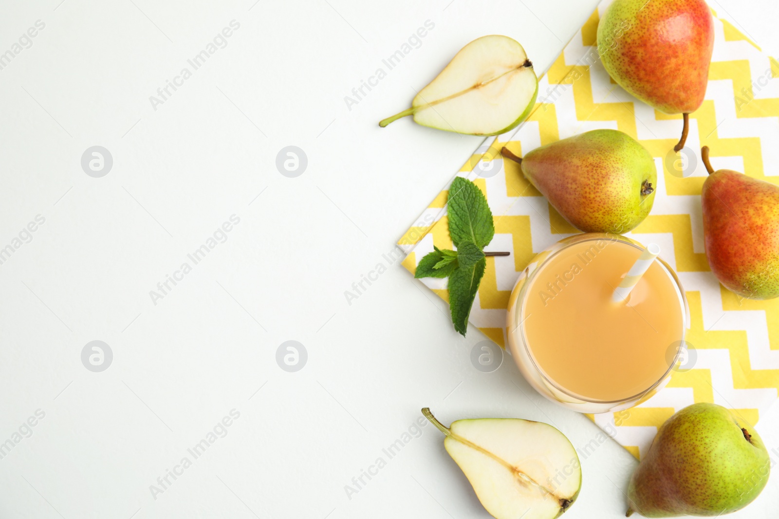 Photo of Tasty pear juice and fruits on white table, flat lay. Space for text