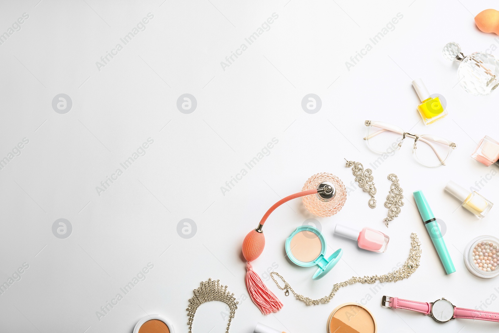 Photo of Composition with perfume bottles, cosmetics and accessories on white background, top view