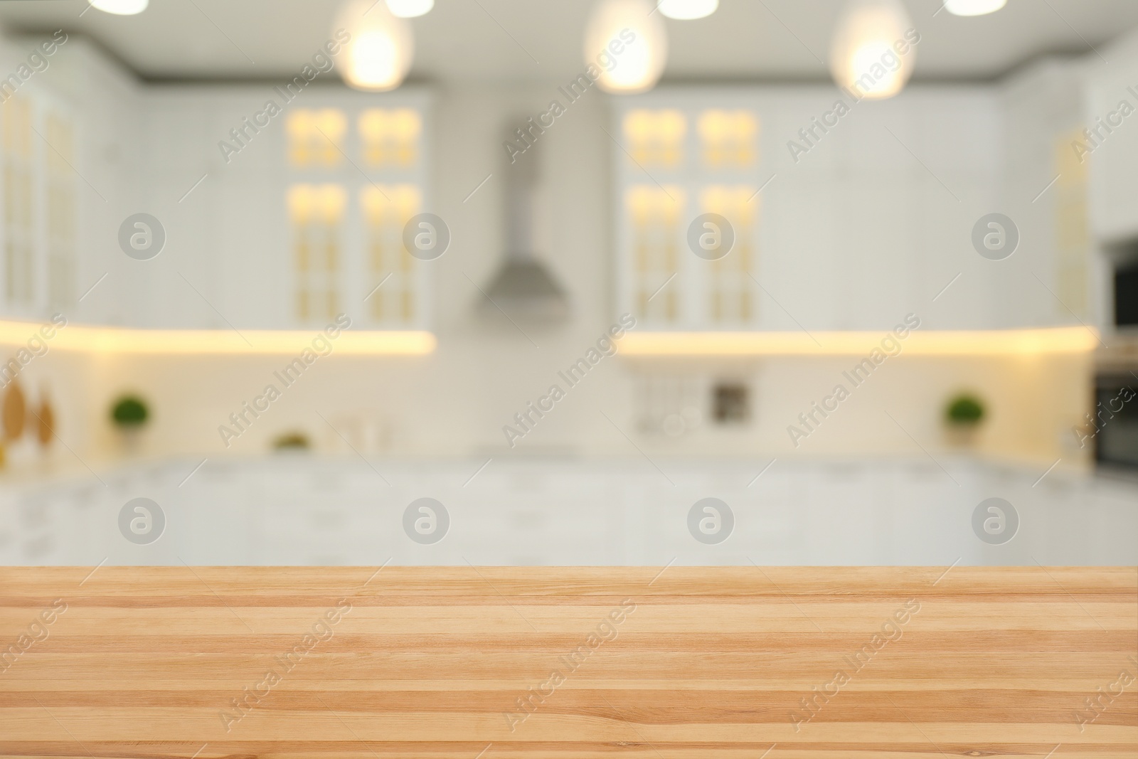 Image of Empty wooden table and blurred view of stylish kitchen interior. Mockup for design