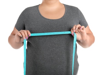 Photo of Overweight woman with measuring tape on white background, closeup