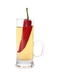 Photo of Red hot chili pepper and vodka in shot glass on white background