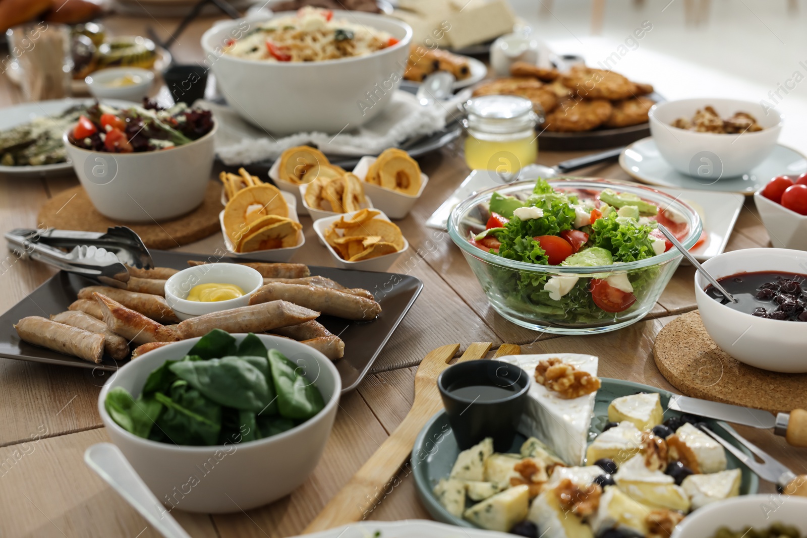 Photo of Brunch table setting with different delicious food indoors