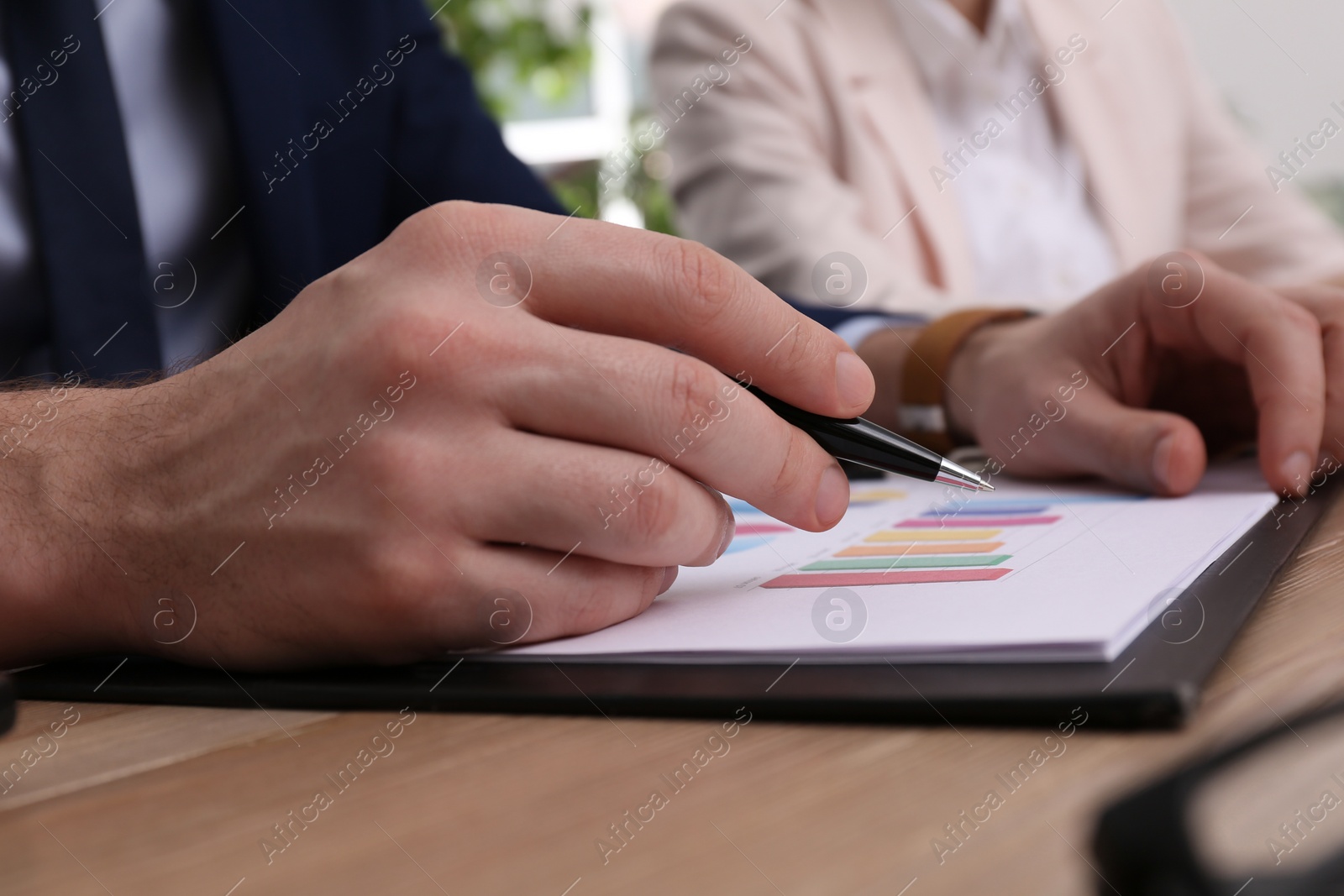 Photo of Business people working with documents at table in office, closeup. Investment analysis