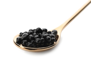 Photo of Metal spoon with black caviar on white background