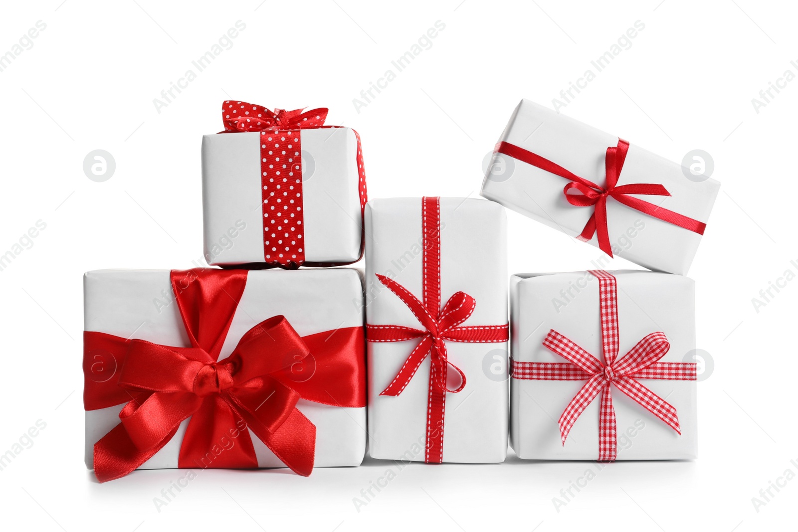 Photo of Beautifully wrapped gift boxes on white background